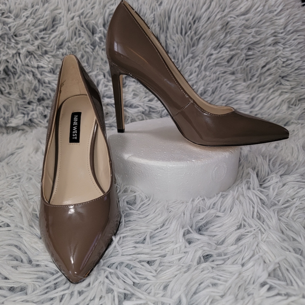 EC Nine West Patent Tan Pumps. Say size 7 but they run a lot smaller.